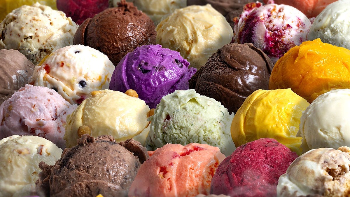 Assorted scoops of colorful ice cream in different flavors.