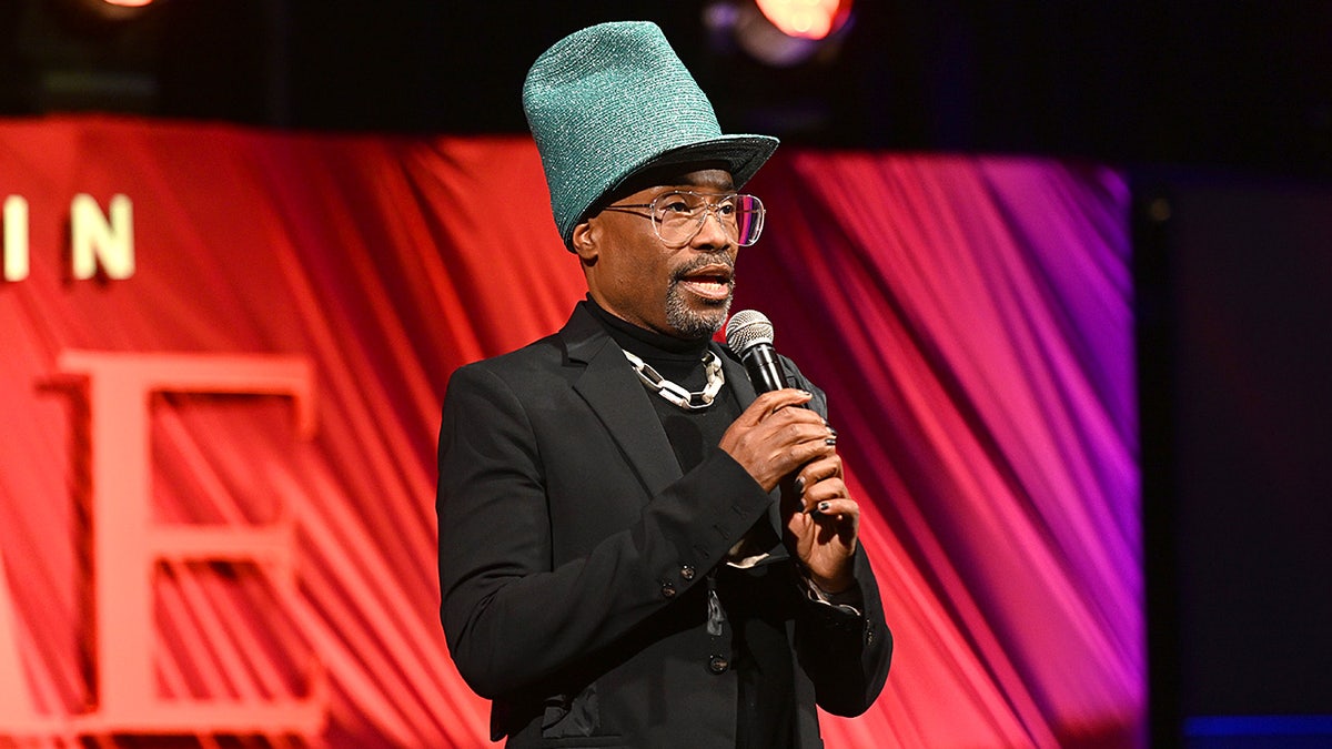 Billy Porter introduces Elton John onstage at TIME event.