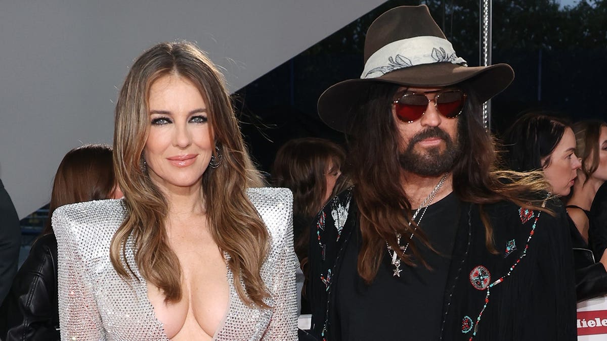 Elizabeth Hurley and Billy Ray Cyrus in London, England for the NTAs in September 2025.