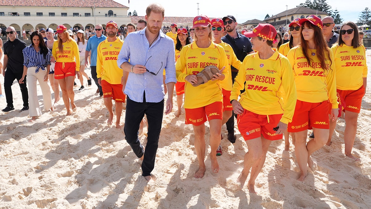 Meghan Markle walks on the beach in Australia with Prince Harry