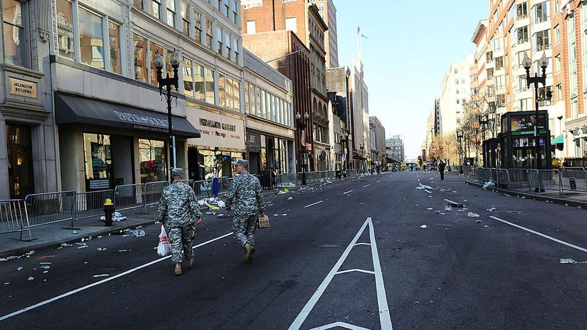National Guard soldiers walking near the Boston Marathon bombing scene in Boston, Massachusetts