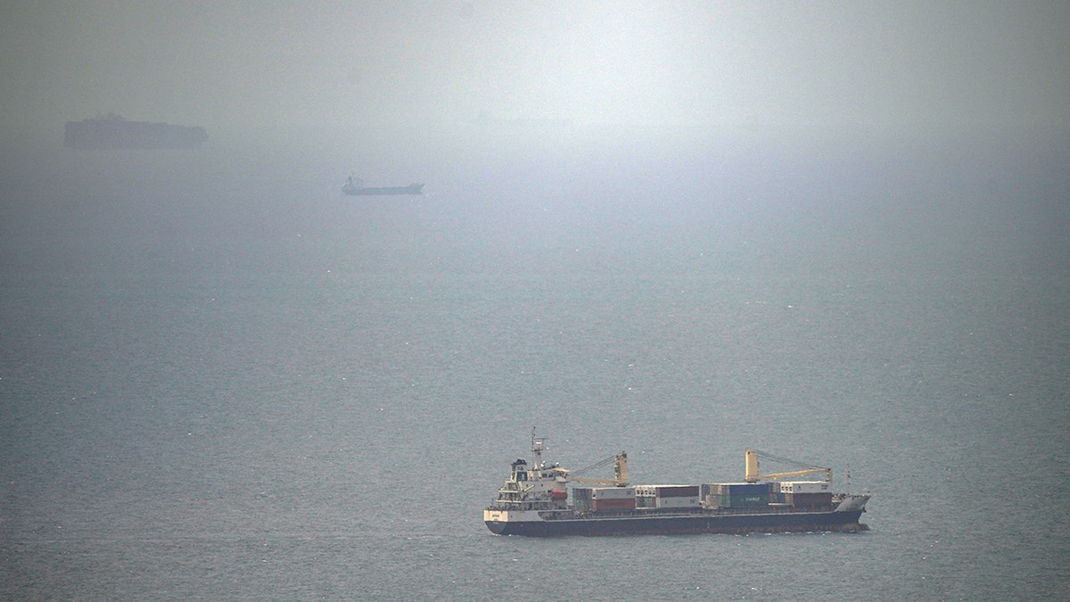 A cargo ship sailing in the Persian Gulf toward the Strait of Hormuz