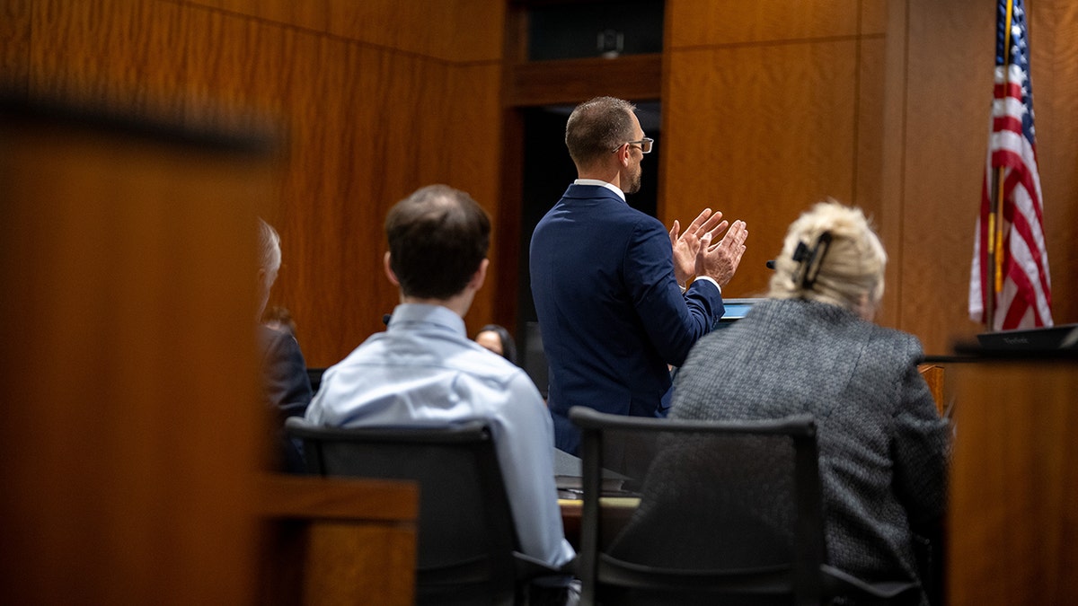 Ryan McBride gesturing in a courtroom hearing for accused of Charlie Kirk killer Tyler Robinson