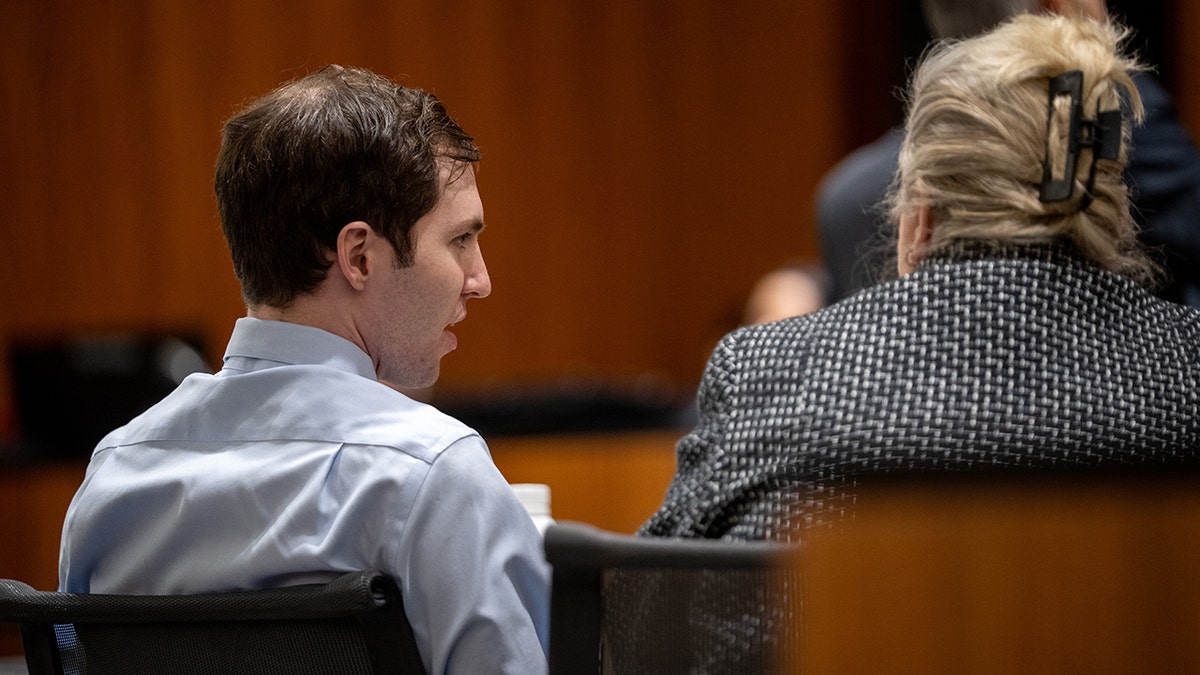 Tyler Robinson and defence  lawyer  Kathryn Nester seated successful  a courtroom successful  Provo Utah