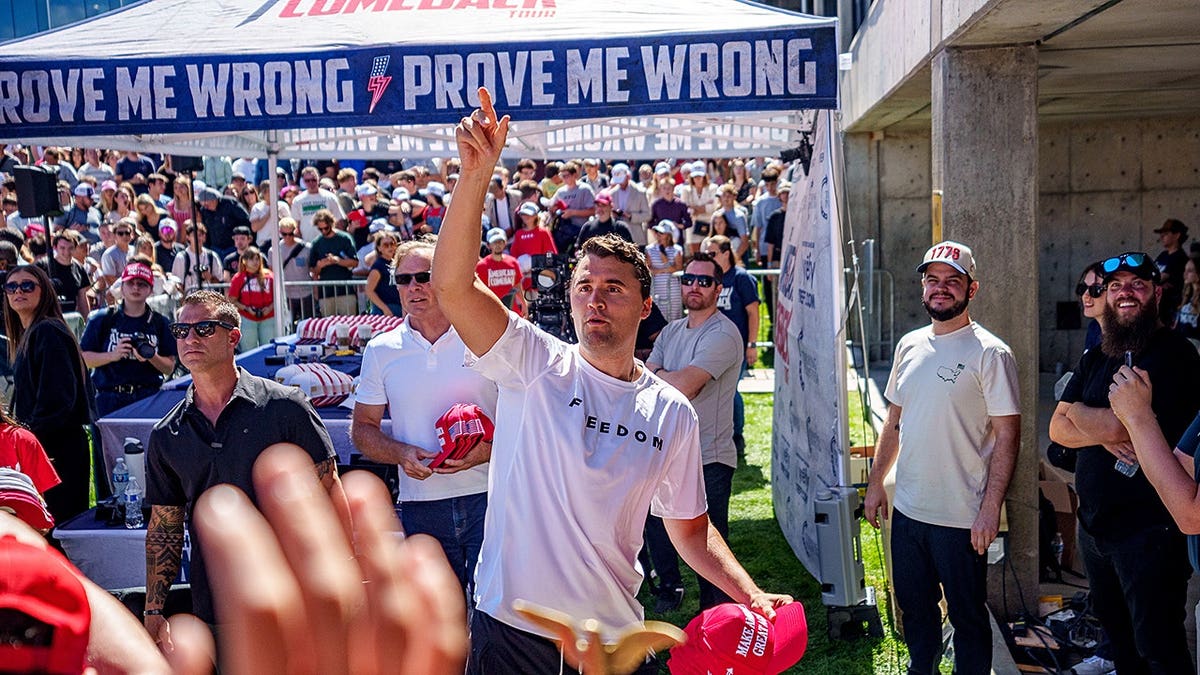 Charlie Kirk throwing hats to crowd at Utah Valley University in Orem Utah