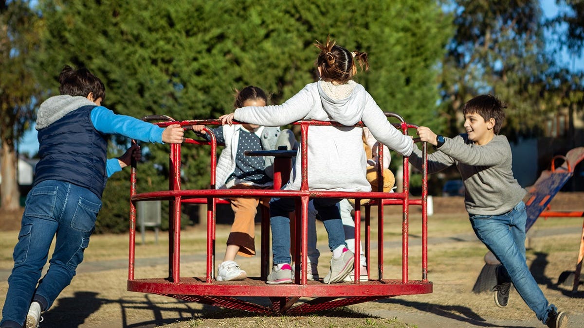 Children playing on a merry-go-round in Buenos Aires