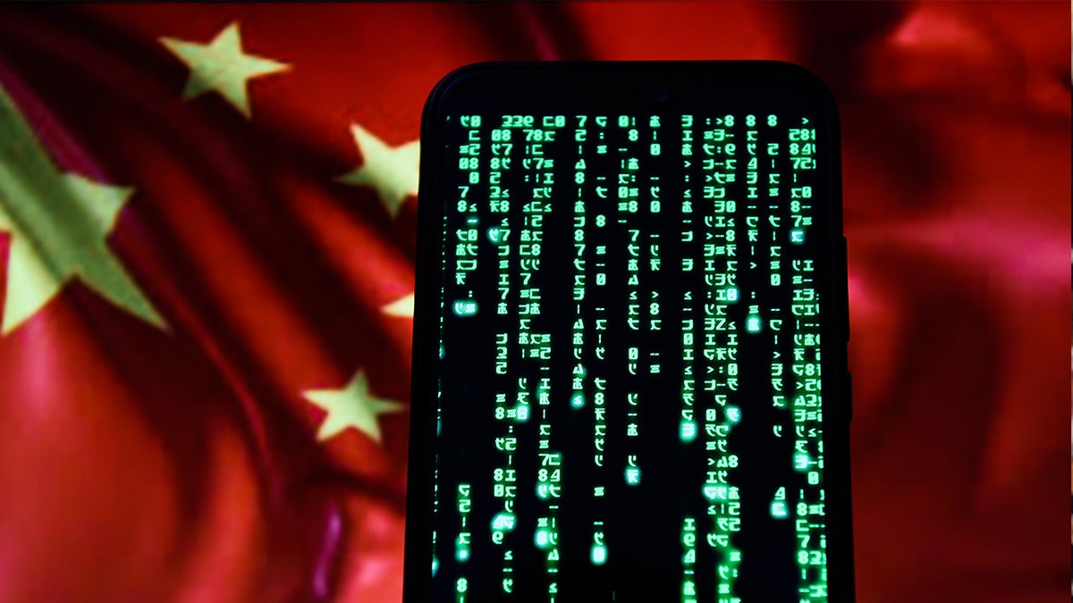 In this photo illustration, Matrix code is seen displayed on an Android mobile phone with Chinese flag in the background.