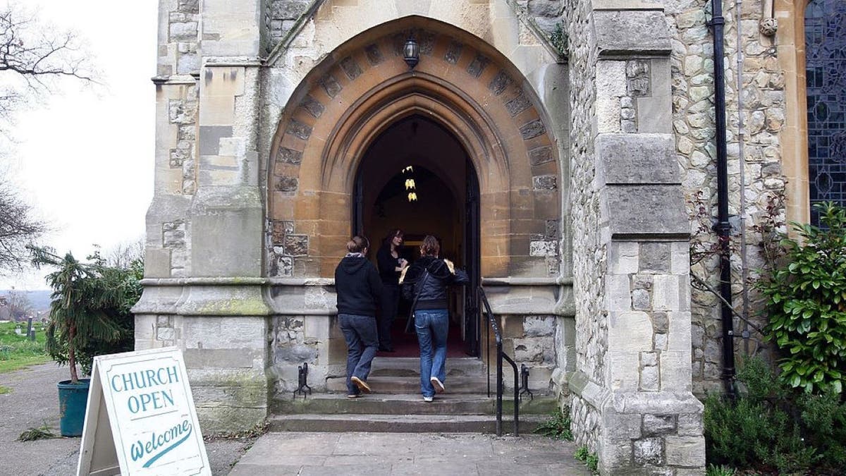 people walk into church