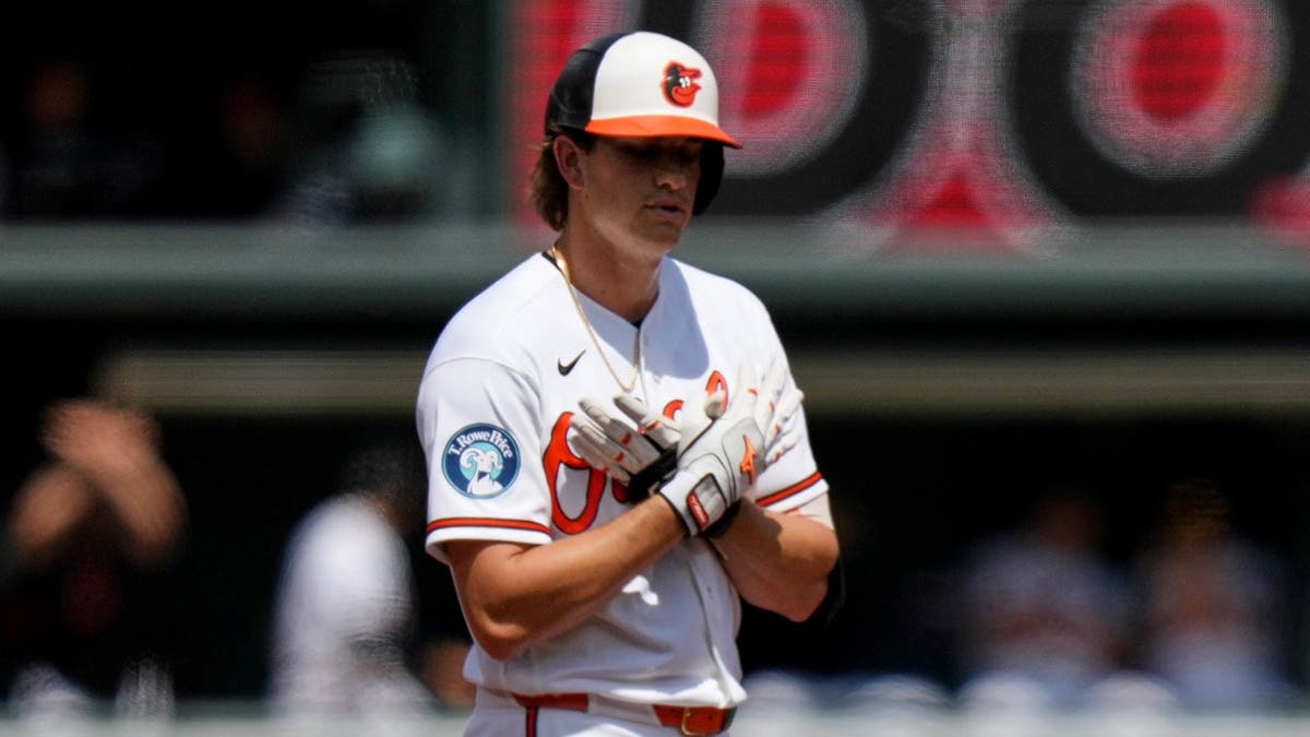 Baltimore Orioles' Coby Mayo celebrating after hitting a double during a baseball game.