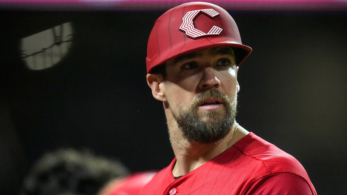 Cincinnati Reds first baseman Collin Cowgill stands on the field during a baseball game.