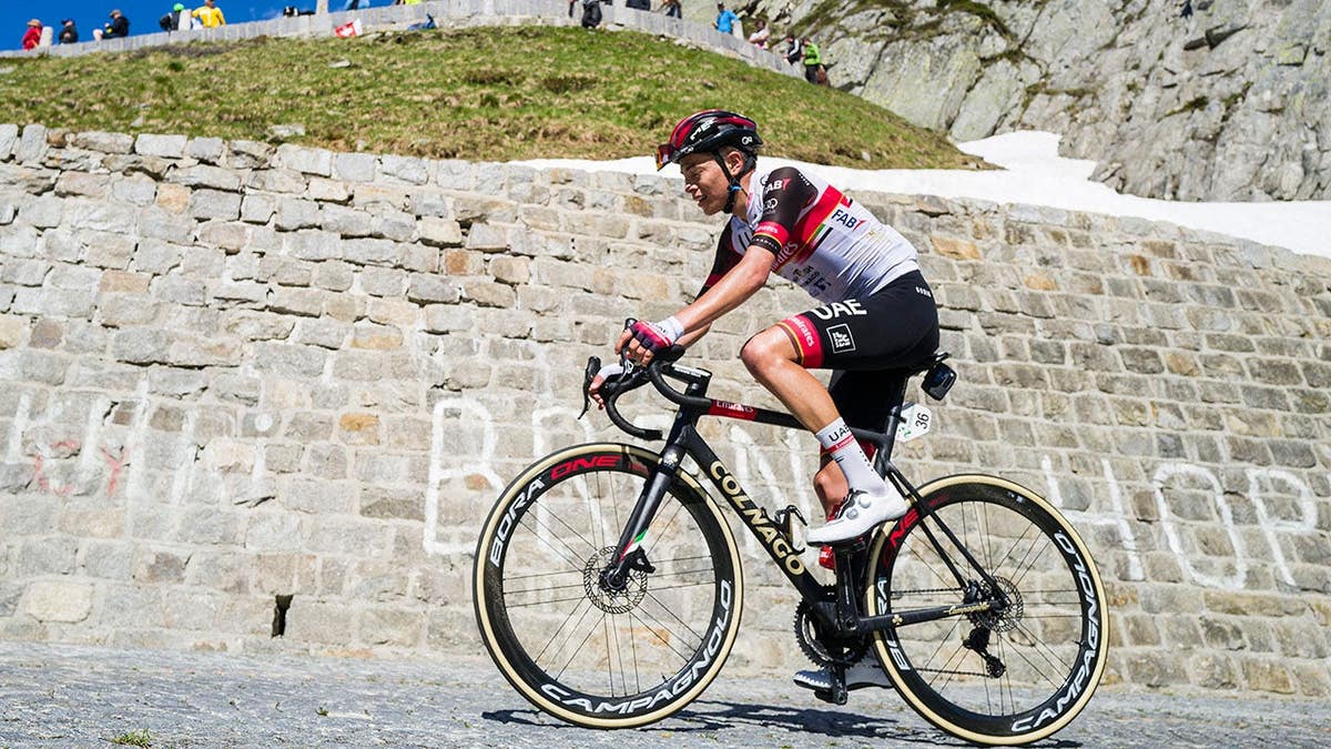 Cristian Camilo Munoz cycling on Gotthard Pass during Tour De Suisse race