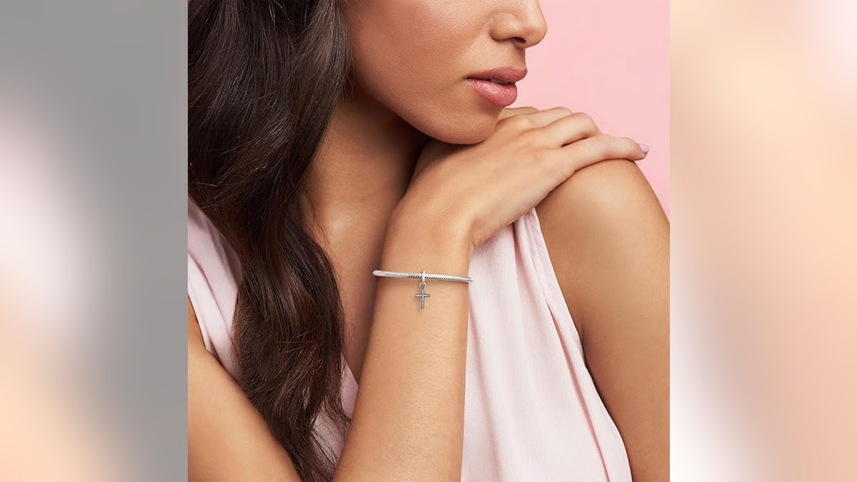 Wear your faith on your wrist when you attach a cross dangle charm.