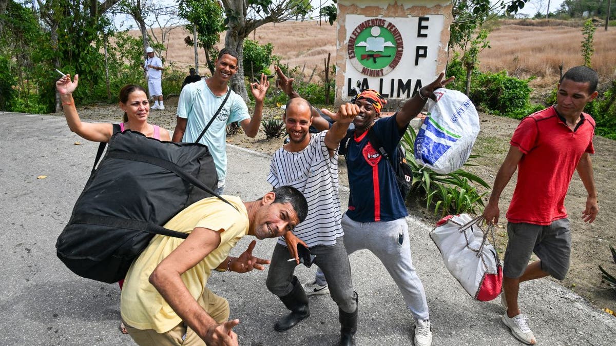 Group of recently released Cuban prisoners walking away from La Lima prison in Havana