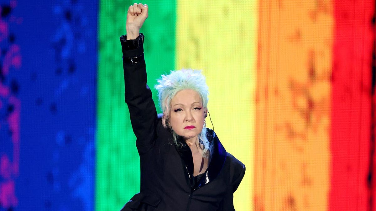 Cyndi Lauper performing onstage at the Rock & Roll Hall of Fame Induction Ceremony