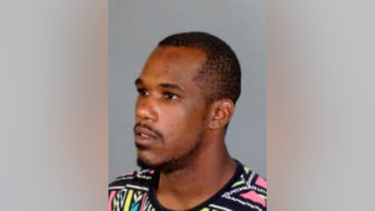 Side profile booking photo of Damian Denzell Robinson, suspect in Los Angeles sexual assault case