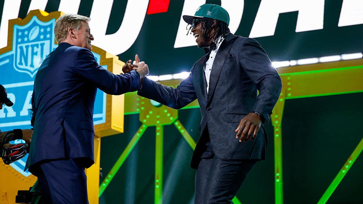 David Bailey embracing NFL Commissioner Roger Goodell at NFL Draft event