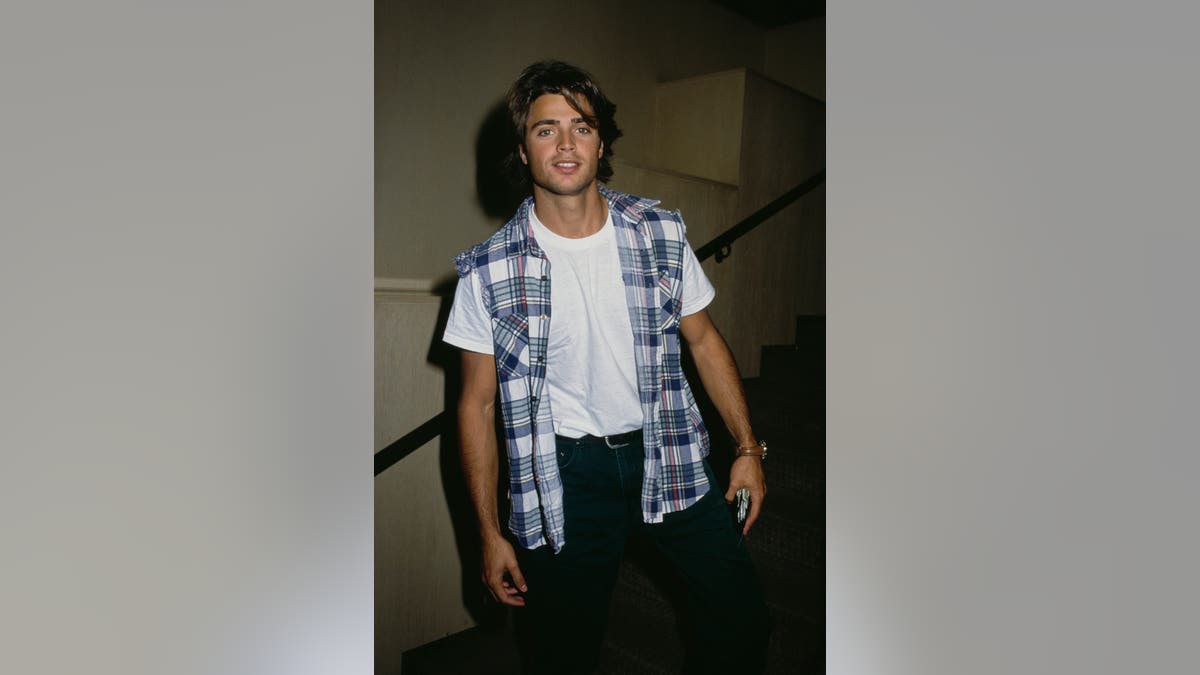 David Charvet standing and looking at the camera.