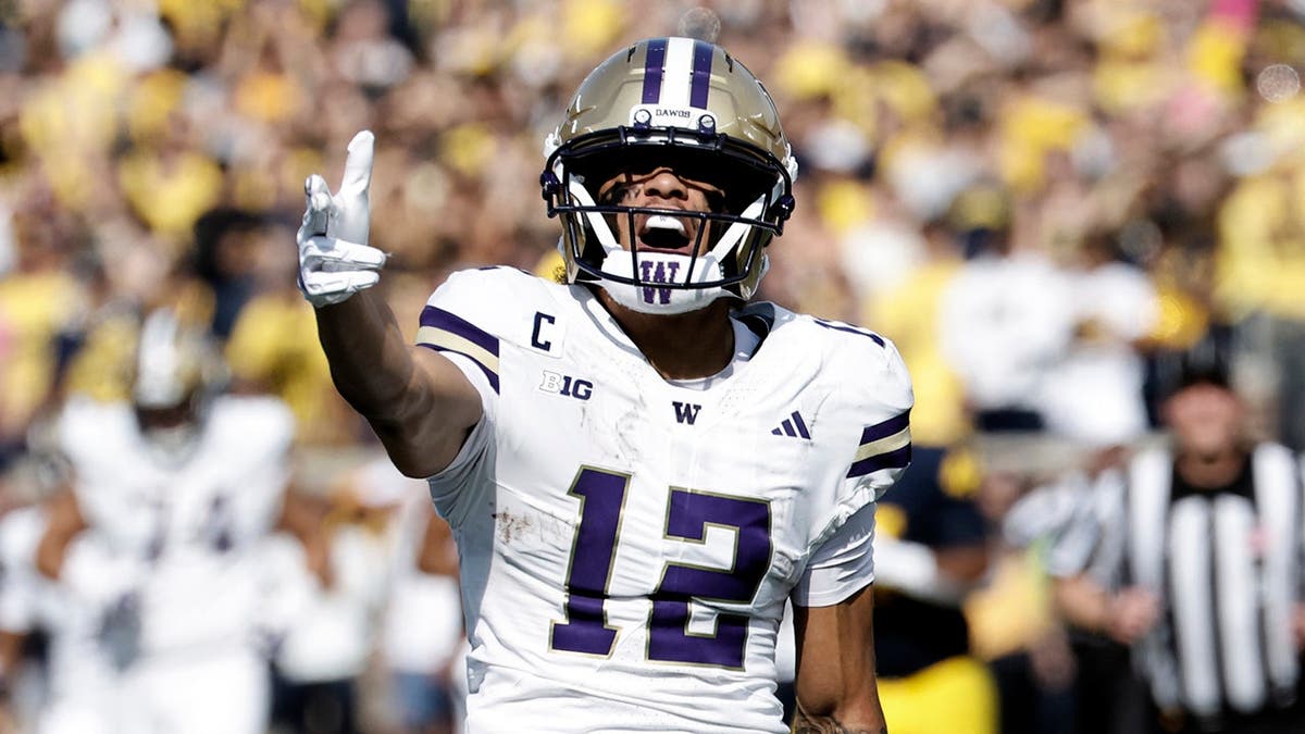 Washington Huskies wide receiver Denzel Boston celebrating after a reception at Michigan Stadium