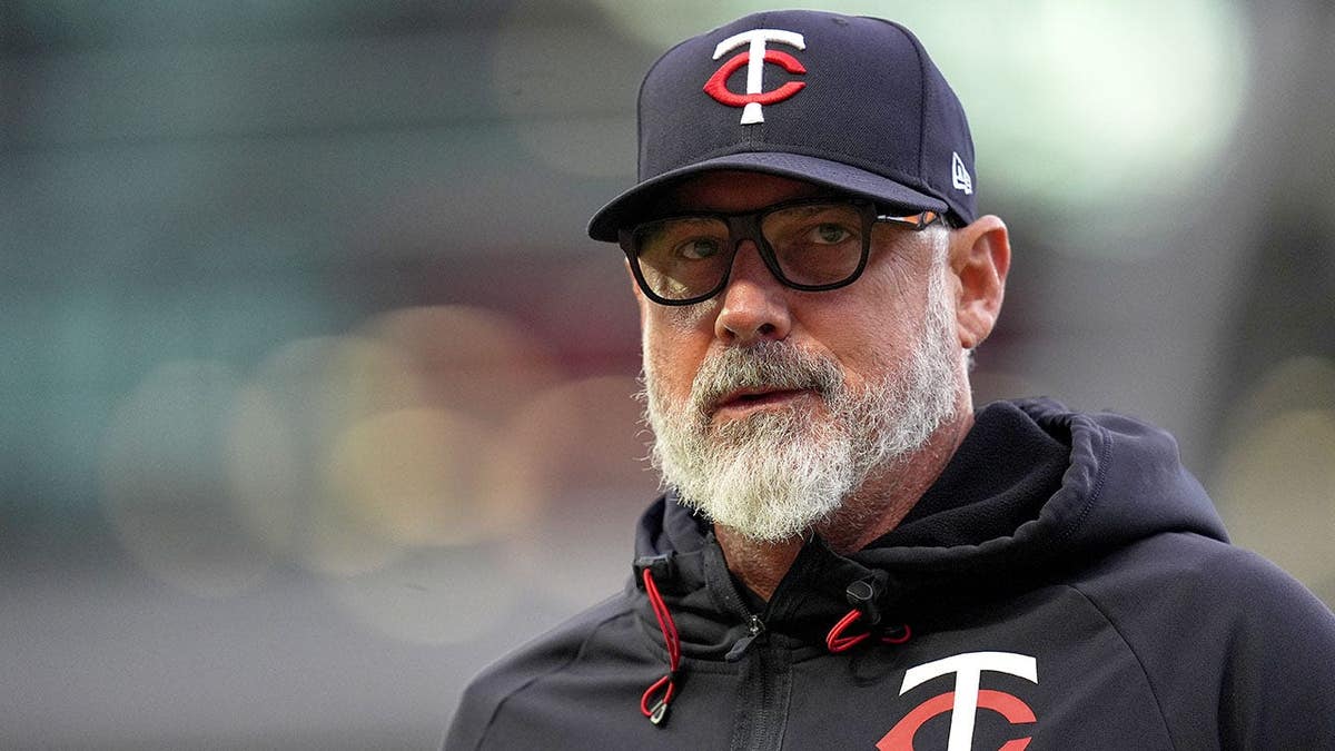 Minnesota Twins manager Derek Shelton walking to dugout during baseball game