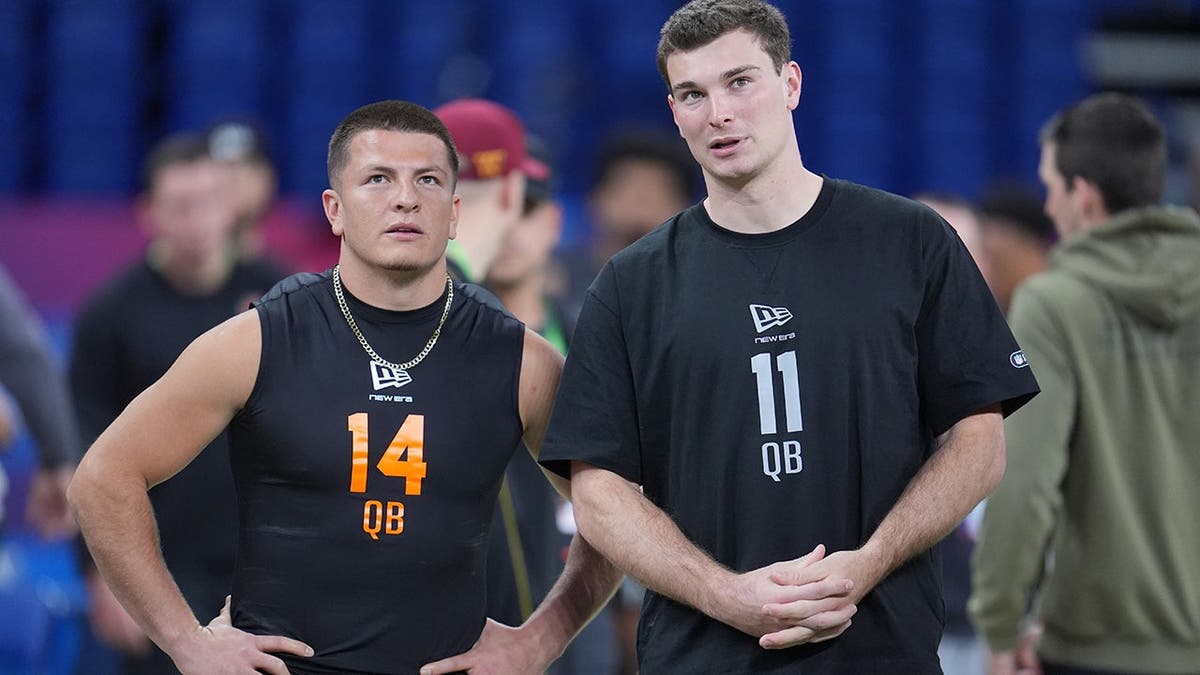 Vanderbilt quarterback Diego Pavia talks to Indiana quarterback Fernando Mendoza during NFL scouting combine drill