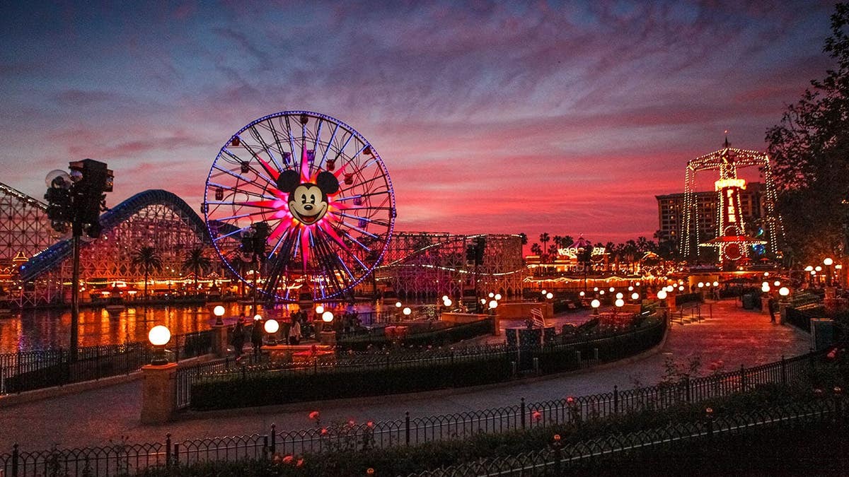 Tourists walking astir   Disney's California Adventure parkland  astatine  dusk