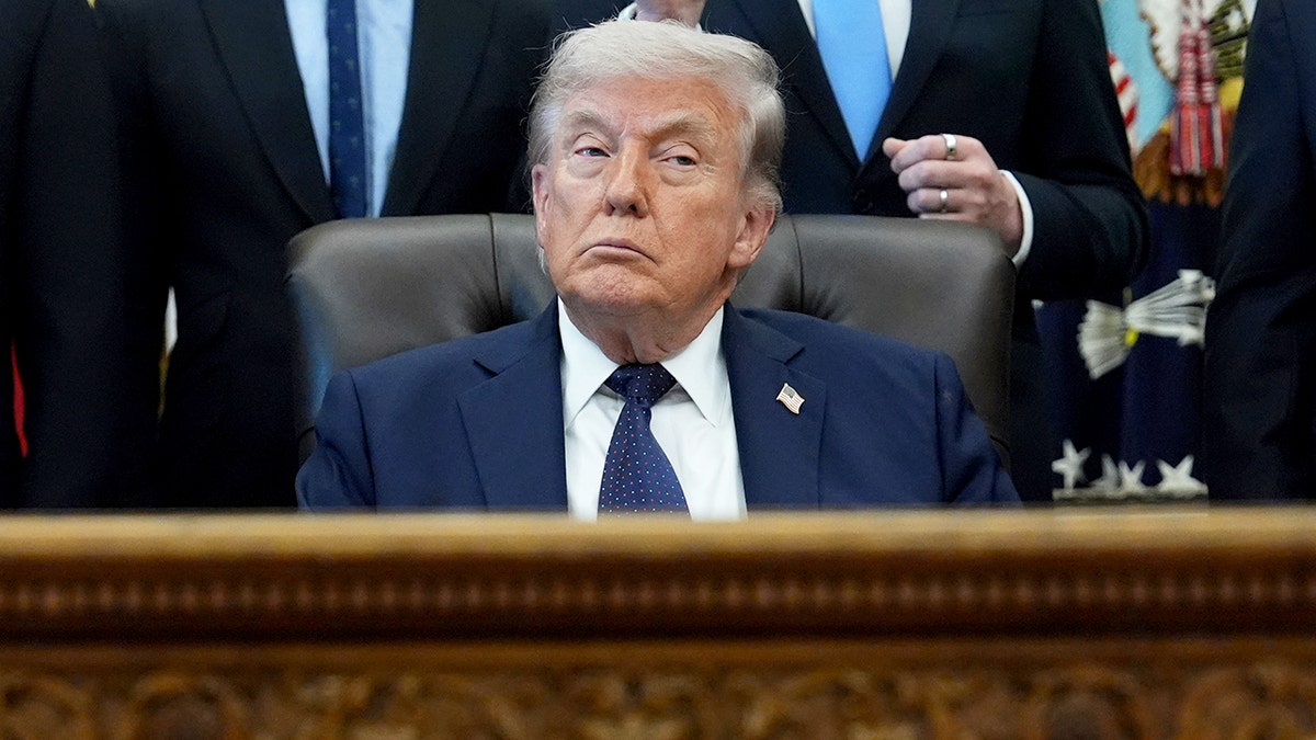 President Donald Trump standing in the Oval Office at the White House