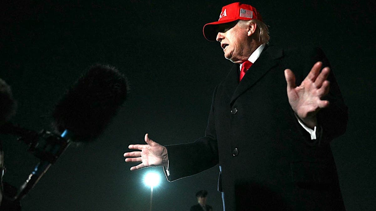 US President Donald Trump speaking to press on tarmac at Joint Base Andrews in Maryland