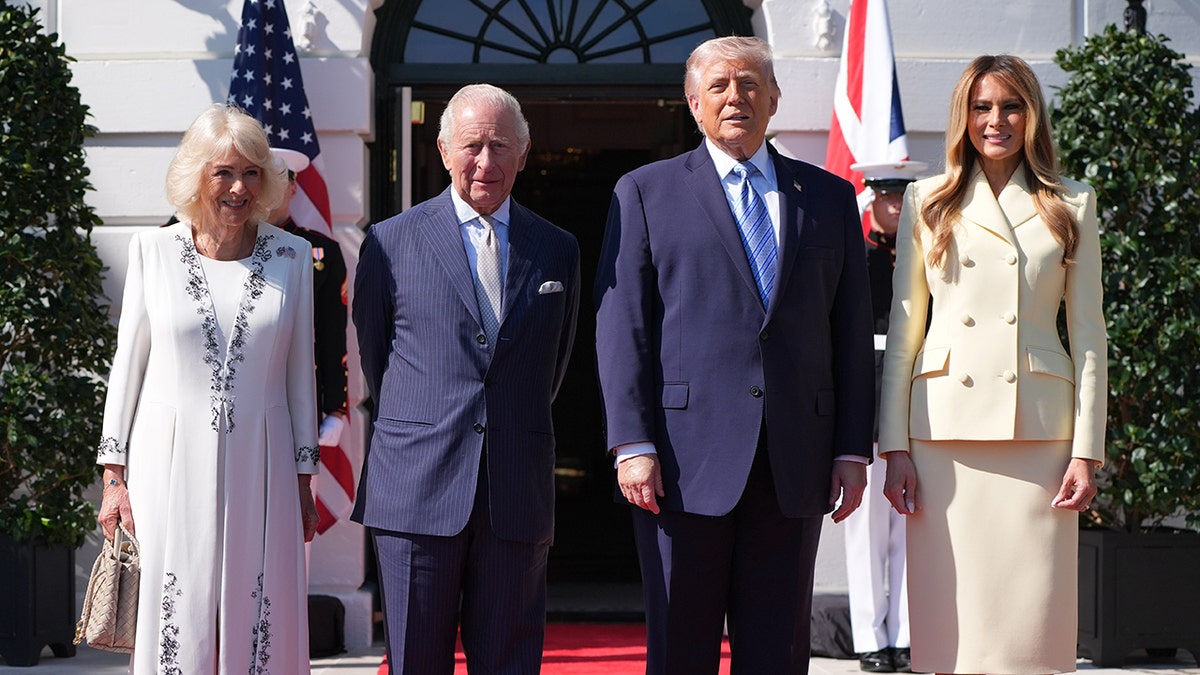 Donald Trump and Melania Trump standing with King Charles III and Queen Camilla at the White House.