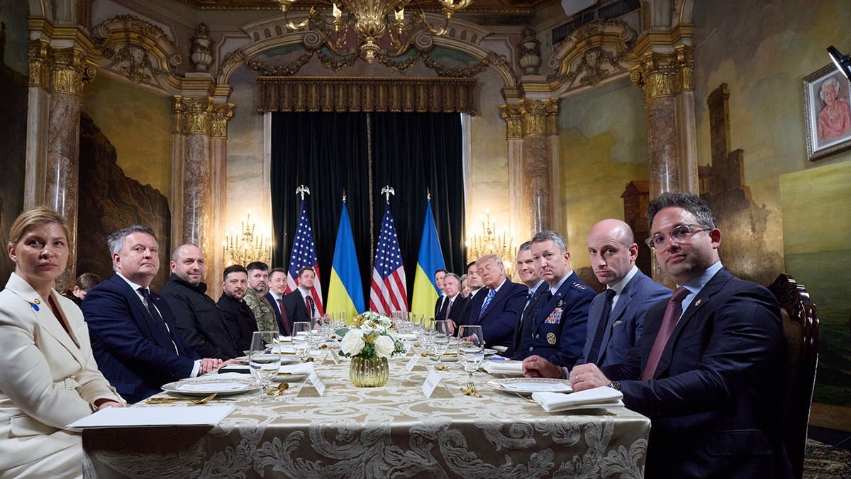 U.S. President Donald Trump and Ukrainian President Volodymyr Zelenskyy seated at a table during a closed-door lunch at Mar-a-Lago