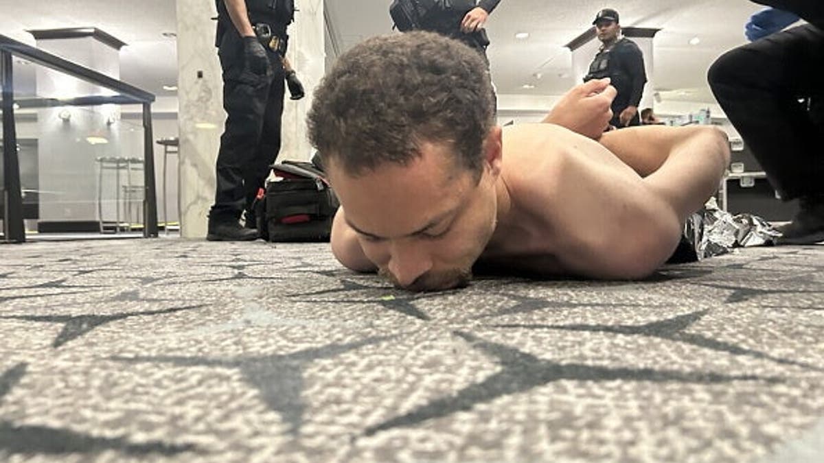 US President Donald Trump posting a photo of law enforcement detaining a suspect