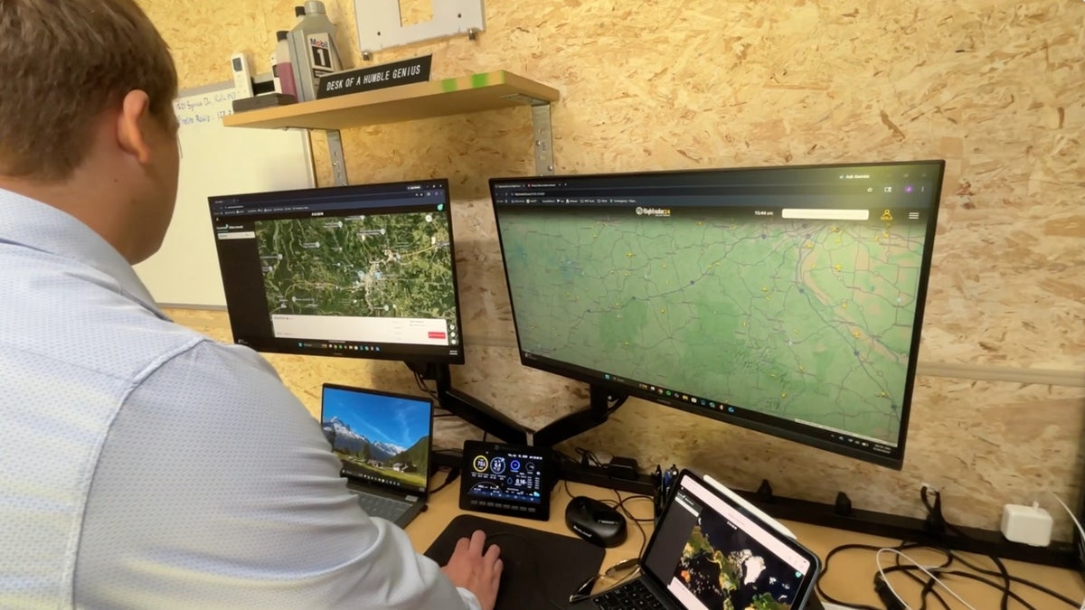 Drone flight monitored on computer maps in control room