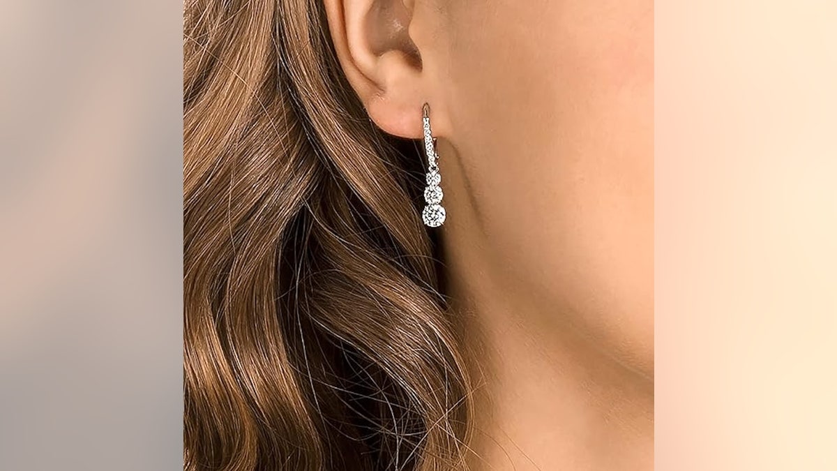 Filled with different-sized crystals, these earrings hang comfortably from your ears.
