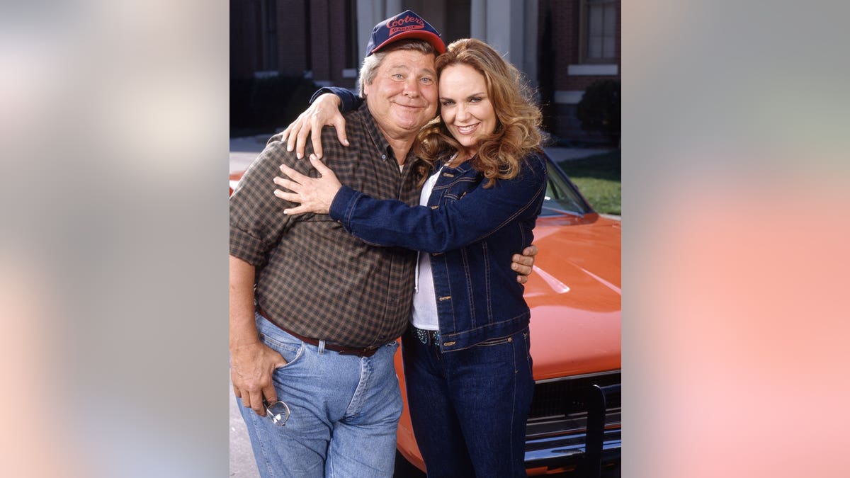 Ben Jones and Catherine Bach posing as characters from The Dukes of Hazzard