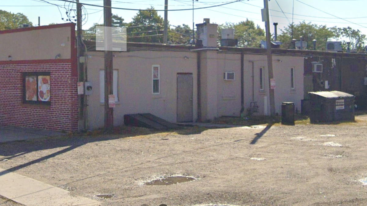 The rear parking lot showing a dumpster where Bonilla Garcia allegedly attacked his victim.