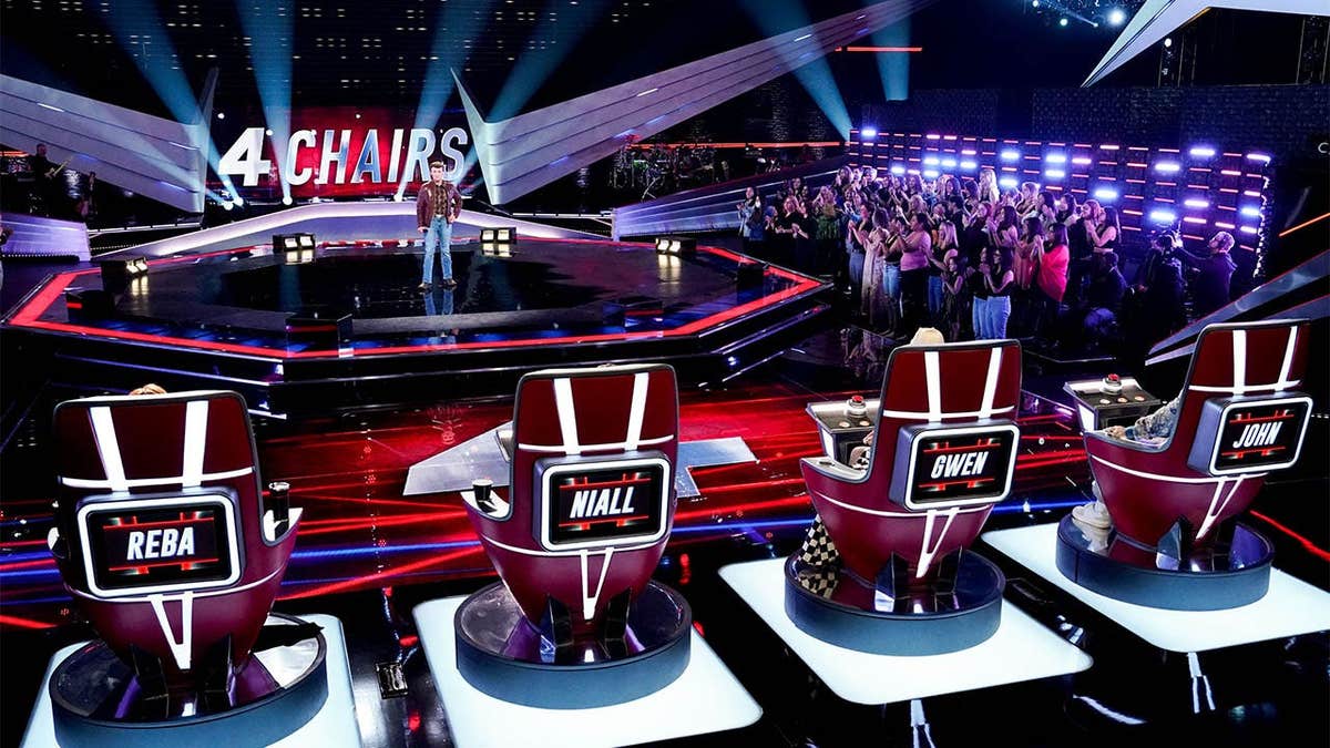 Dylan Carter seated on a stage during The Voice blind auditions.