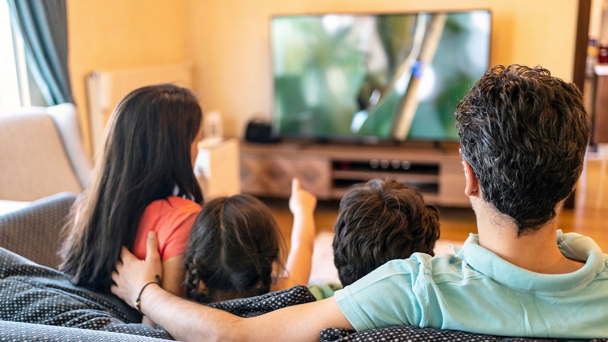 Family watches TV