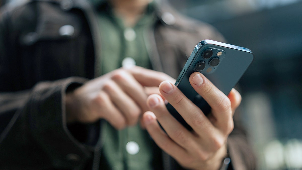 A person uses an iPhone.