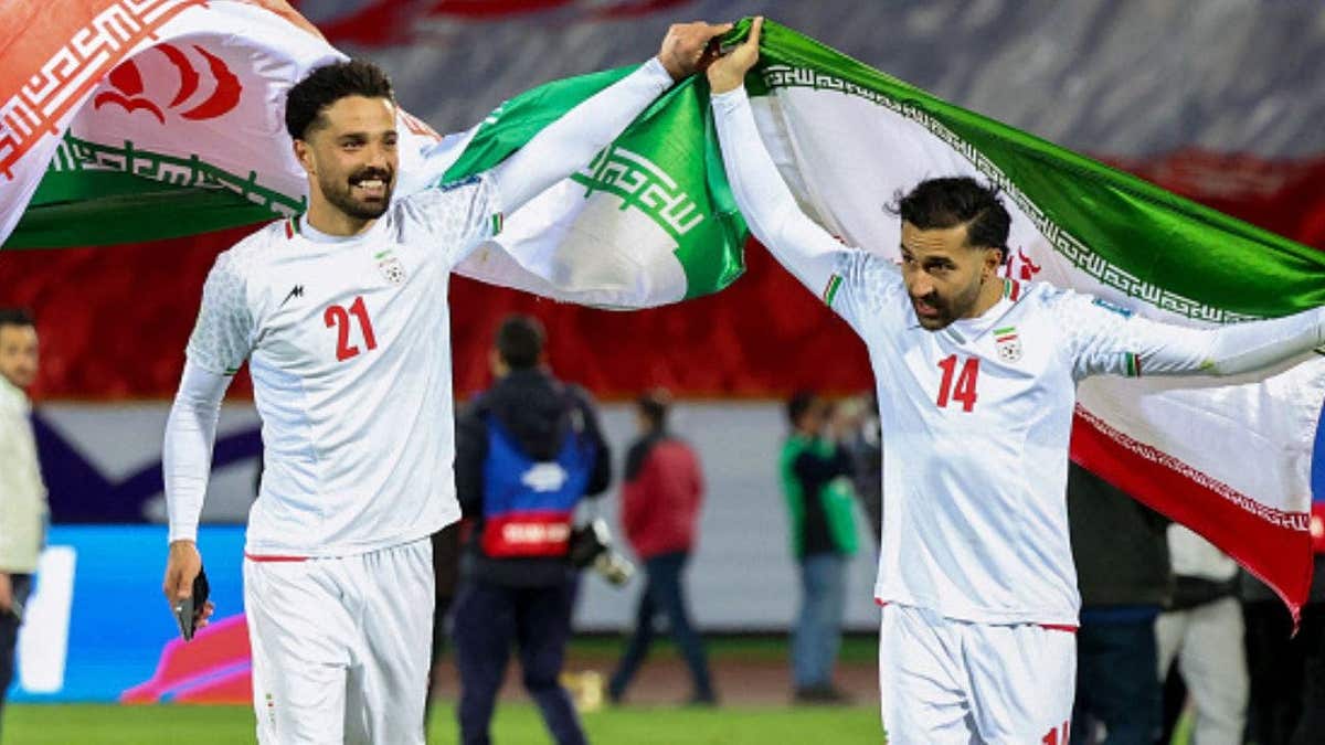 Iran's players #21 Omid Norafkan and #14 Saman Ghoddos celebrate after the FIFA World Cup 2026 Asia zone qualifiers group A football match between Iran and Uzbekistan, on March 25, 2025 in Tehran. (Photo by AFP) (Photo by -/AFP via Getty Images)