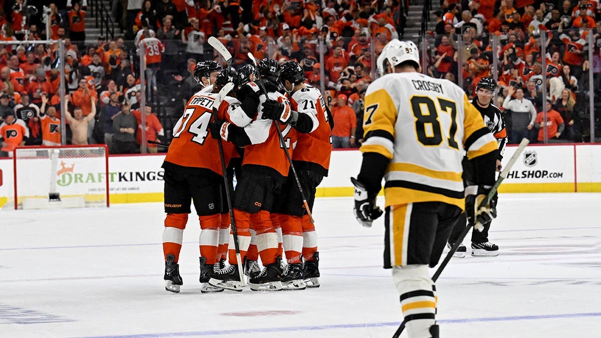 Flyers celebrate in front of Sidney Crosby