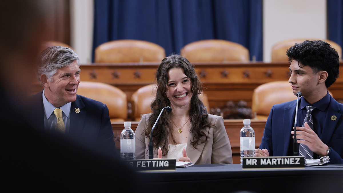 Jocelyn Fetting and Jaden Martinez, two adults who were in the foster care system as children, speak during a roundtable discussion on foster care.