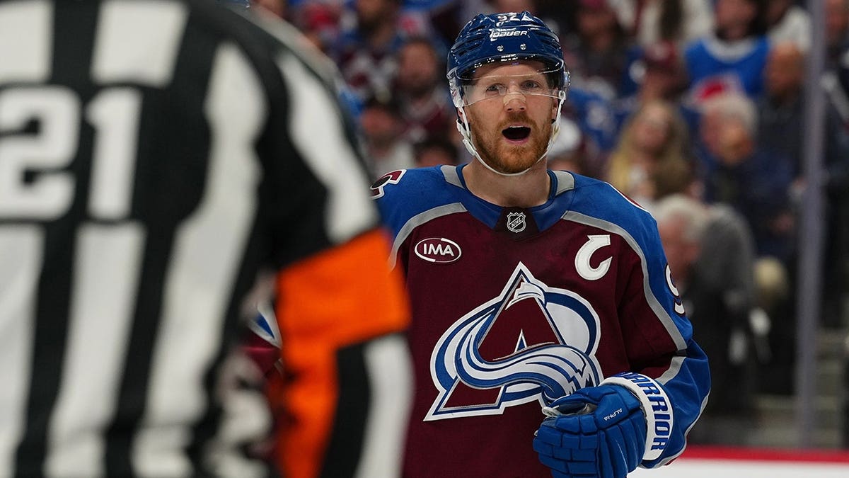 Colorado Avalanche left wing Gabriel Landeskog arguing with referee TJ Luxmore on ice during NHL playoff game