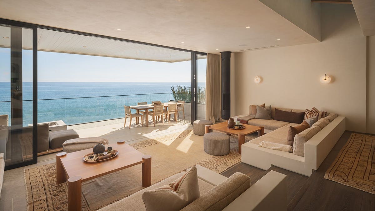 An outdoor terrace with a dining and lounge area