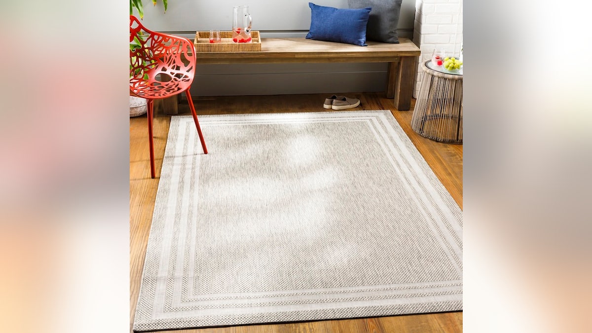 Add beige and beach tones to your decor with this rug.