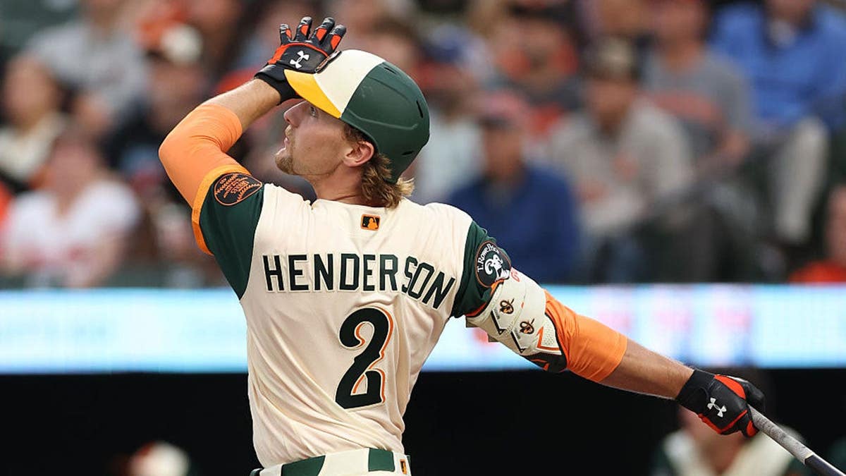 Gunnar Henderson of the Baltimore Orioles watching his home run at Oriole Park at Camden Yards