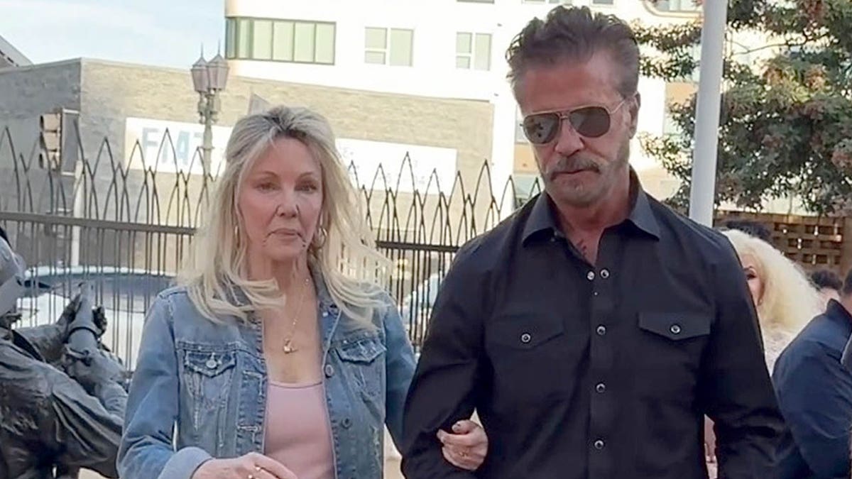 Heather Locklear and Lorenzo Lamas walk arm in arm in Los Angeles
