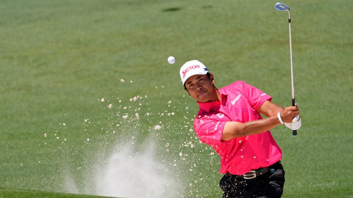 Hideki Matsuyama plays a shot from a bunker during the second round of the 2026 Masters at Augusta National Golf Club in Georgia.