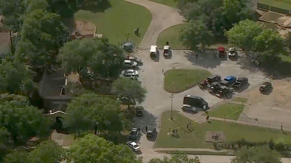 Police searched the area where a body was found in Houston on Thursday.