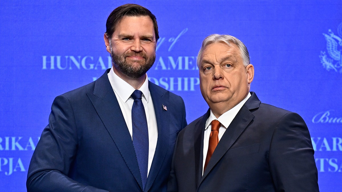 Viktor Orban and JD Vance standing during a press conference.