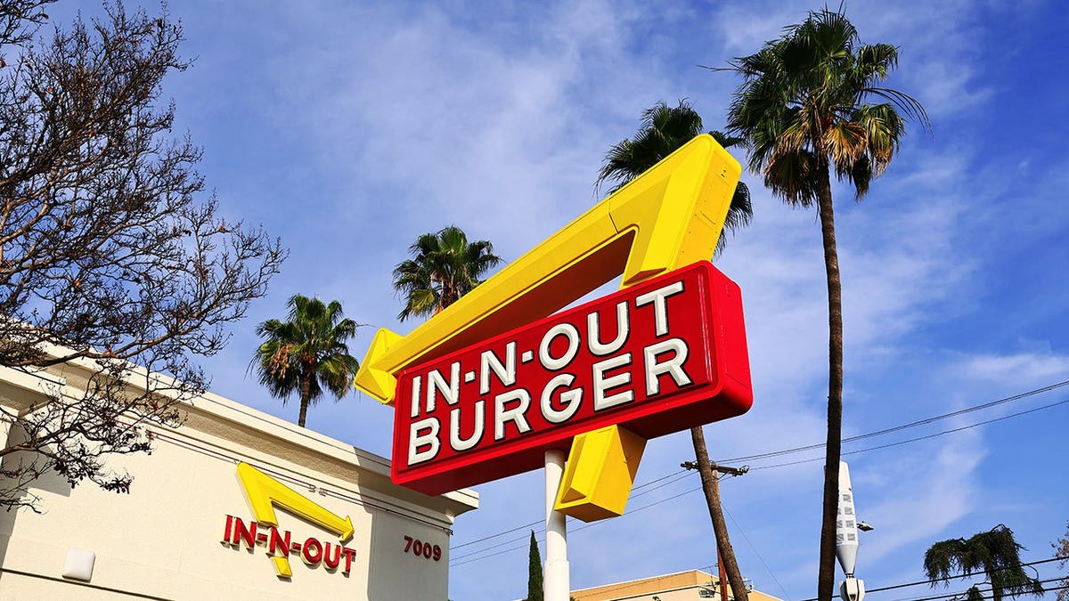In-N-Out Burger sign illuminated at night in Los Angeles