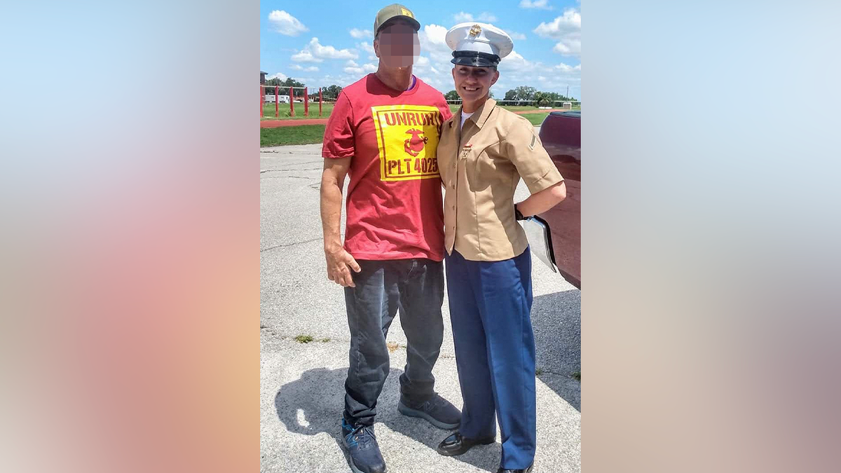 Ivy Unruh in Marine Corps uniform posing in photo with another person.